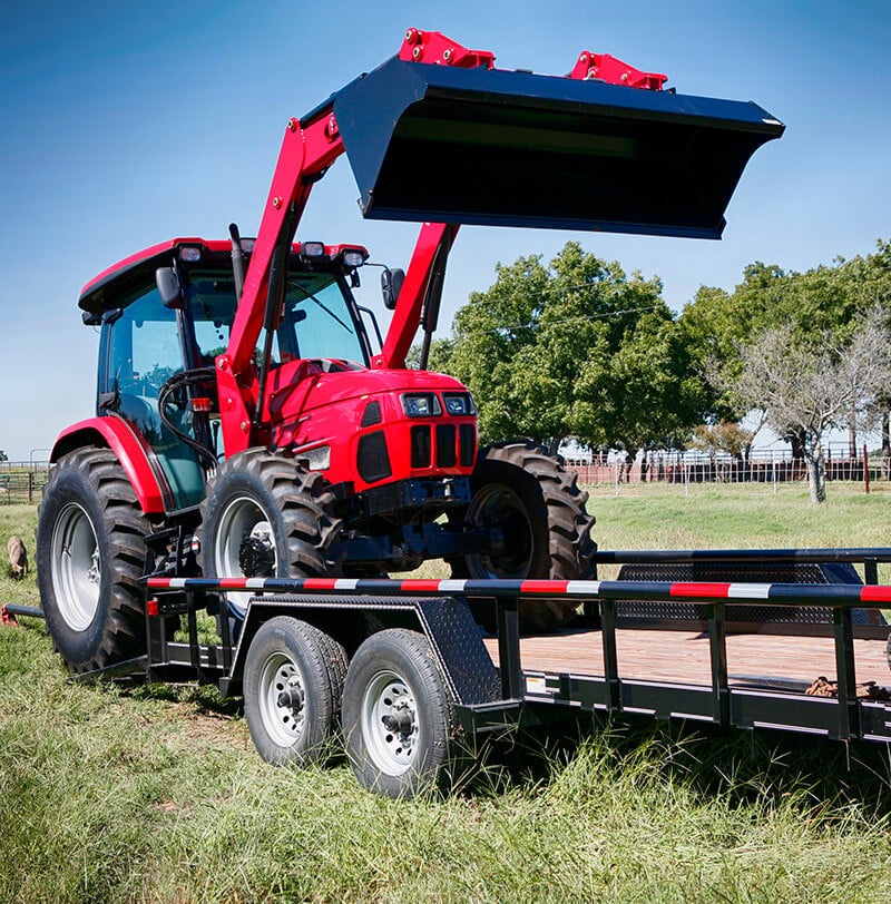 Red Tractor Being Transported